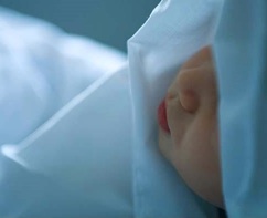 A stillborn found in laundry service sheet
